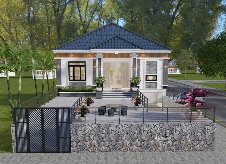 Mẫu nhà cấp 4 hiện đại mái ngói xanh, sân trước rộng và tường đá tự nhiên
