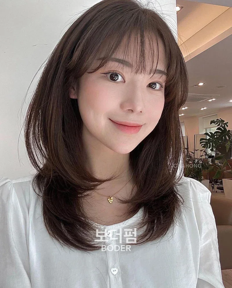 Tóc layer ngang vai uốn cụp đuôi